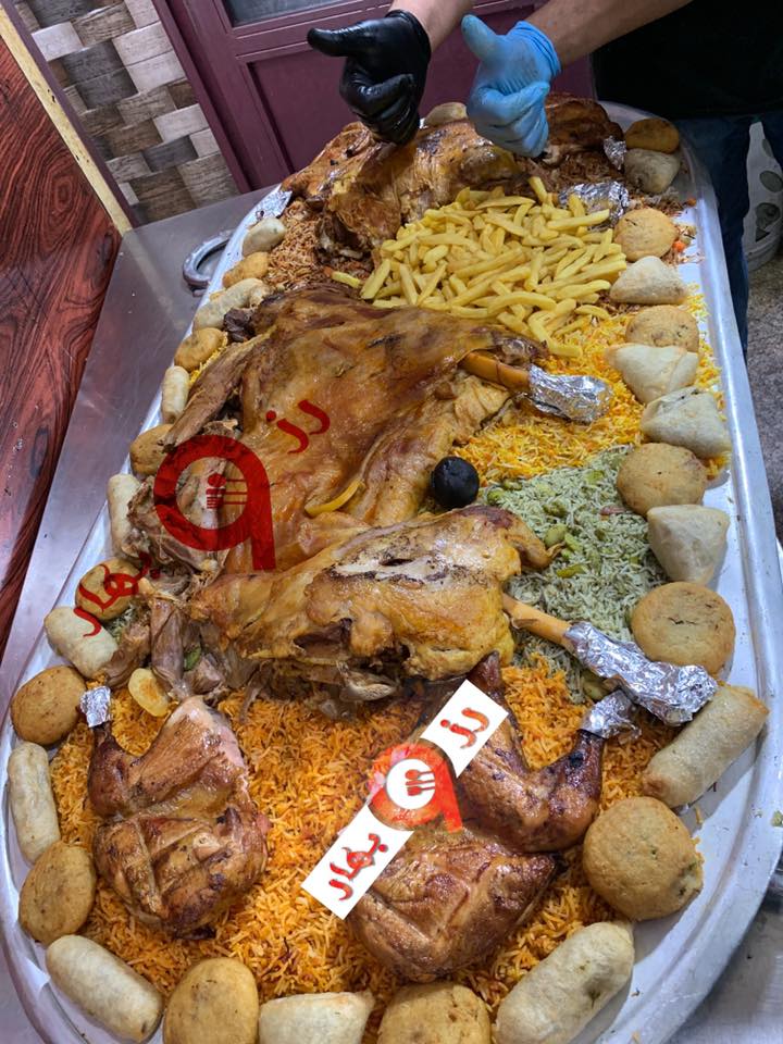 نصف خروف على الرز 